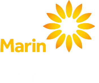 Logo for Marin Community Clinics featuring a stylized yellow and orange sunburst with the words Marin Community Clinics below, where Marin is in bold orange and Community Clinics is in light gray.