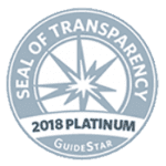 A circular badge with a starburst design in the center, labeled Seal of Transparency. Below it reads 2018 Platinum GuideStar. The badge is in shades of light blue and gray.