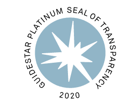 A circular badge with a light blue starburst in the center and the words Guidestar Platinum Seal of Transparency 2020 written around the edge.