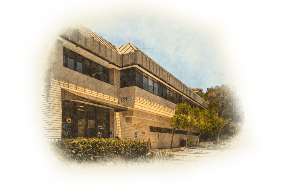 Artistic rendering of a modern, two-story office building with large windows and an angular roof, surrounded by bushes and trees, under a partly cloudy sky.