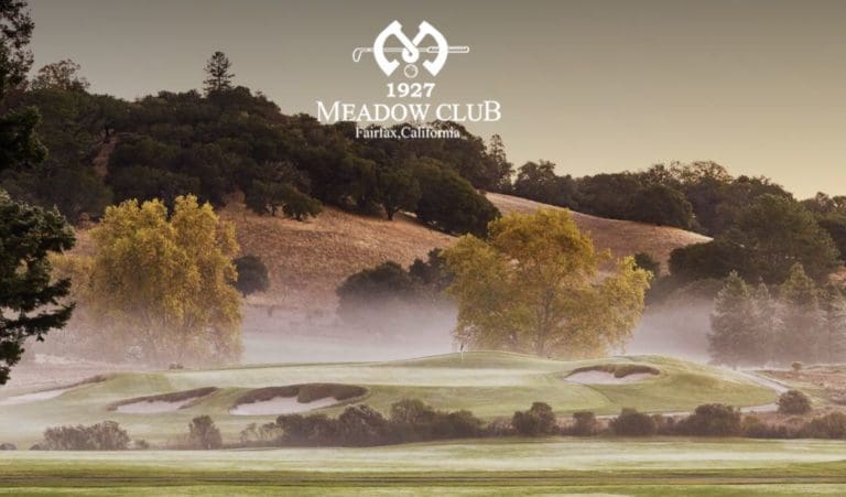 A scenic golf course at Meadow Club in Fairfax, California, with rolling hills, trees, sand bunkers, and early morning fog, under a logo that reads “1927 Meadow Club Fairfax, California.”.